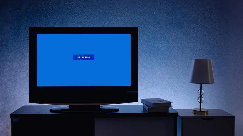 Computer monitor in living room showing a No Signal error