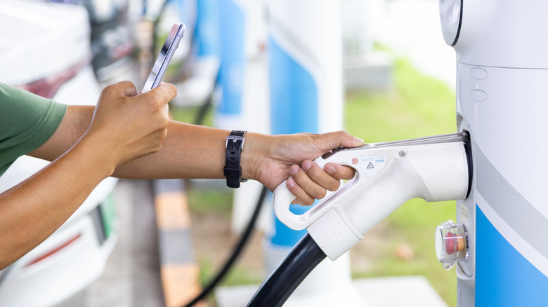 person setting up charging their EV