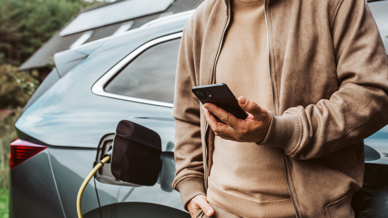 person using app for ev chargers