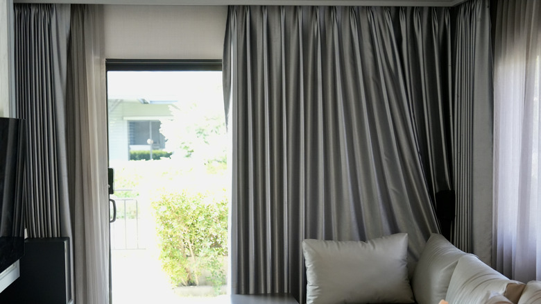 Blackout curtains hung in a living room.