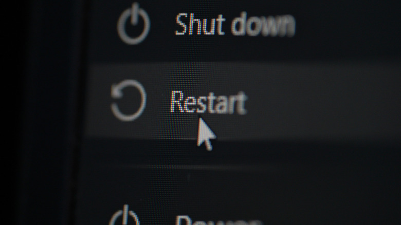 Close-up of computer screen with Restart button highlighted
