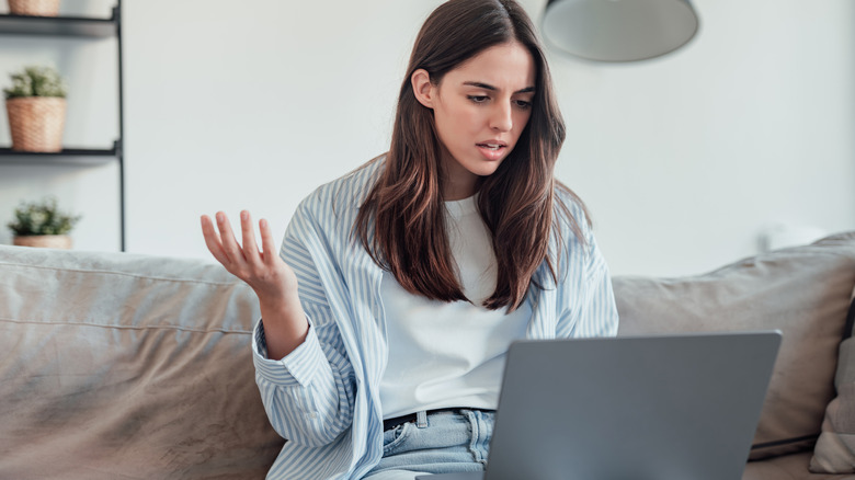 Woman frustrated with computer performance
