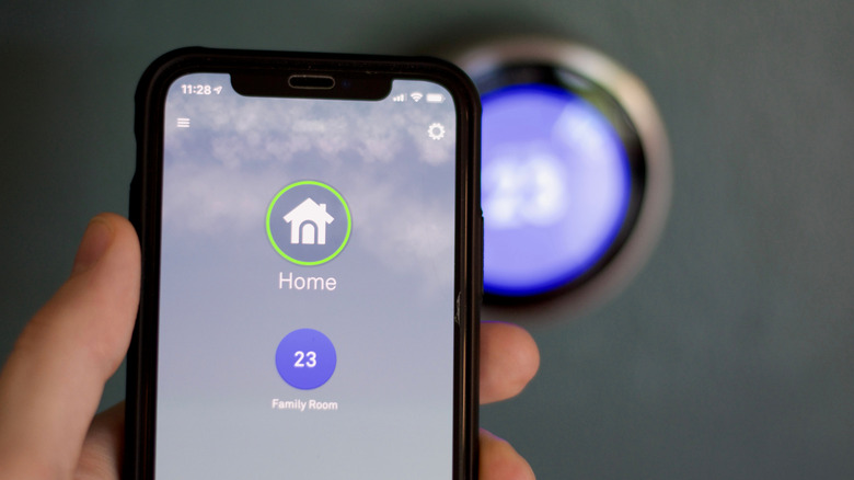 Nest Thermostat being controlled by a mobile app