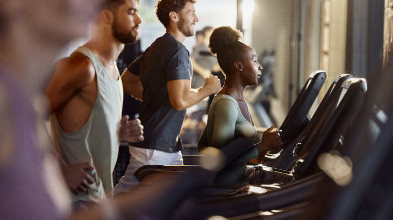 People using treadmills at a gym
