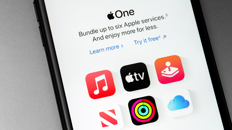 A smartphone displaying information about Apple One Services, including several icons denoting the various services, including Apple Music, Apple TV, Apple Arcade, Apple News+, Apple Fitness, and iCloud+