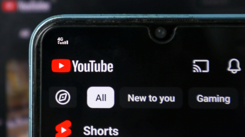 Phone showing YouTube app with cast icon