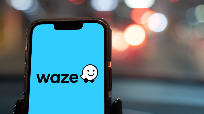 waze logo on smartphone in car