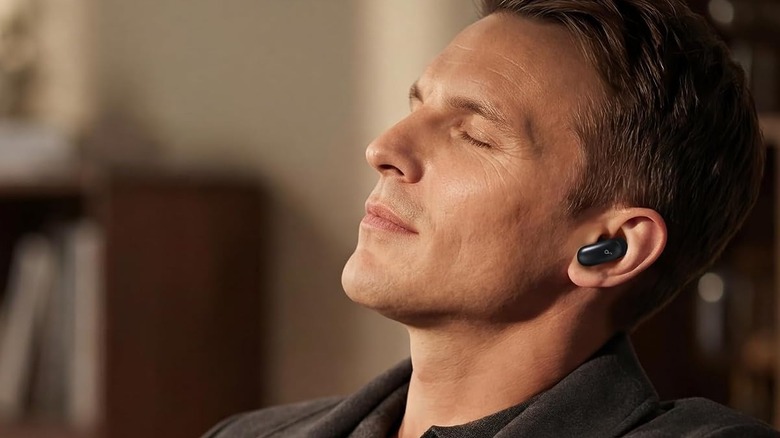 A man wearing the Anker Soundcore Liberty 5 Pro earbuds.