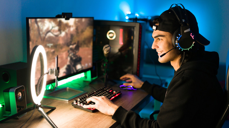 A livestreamer enjoys using his monitor to play video games