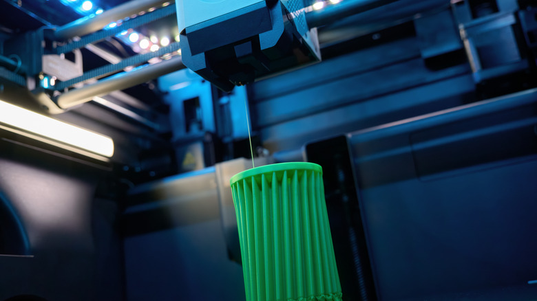 A 3D printer creating an object.