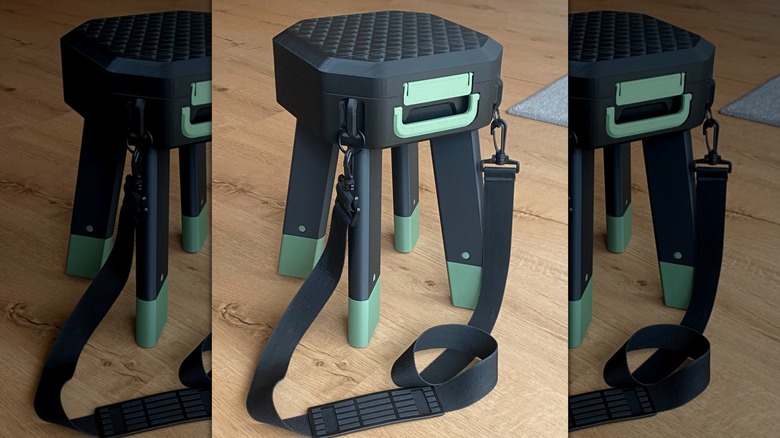 A 3D printed collapsible stool with a shoulder strap.