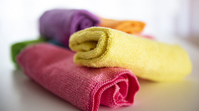Several rolled-up microfiber cloths.