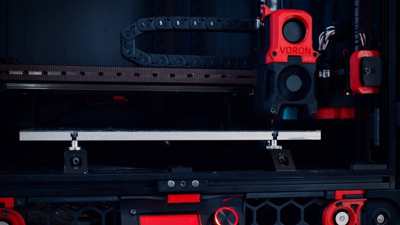 Close up of the Voron 2.4 3D printer head and build plate.