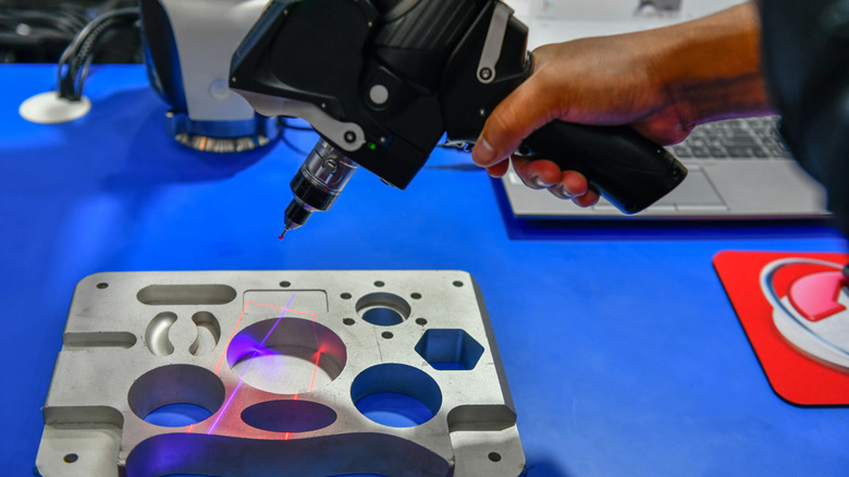 Handheld scanner used to map and 3D print complex auto parts.