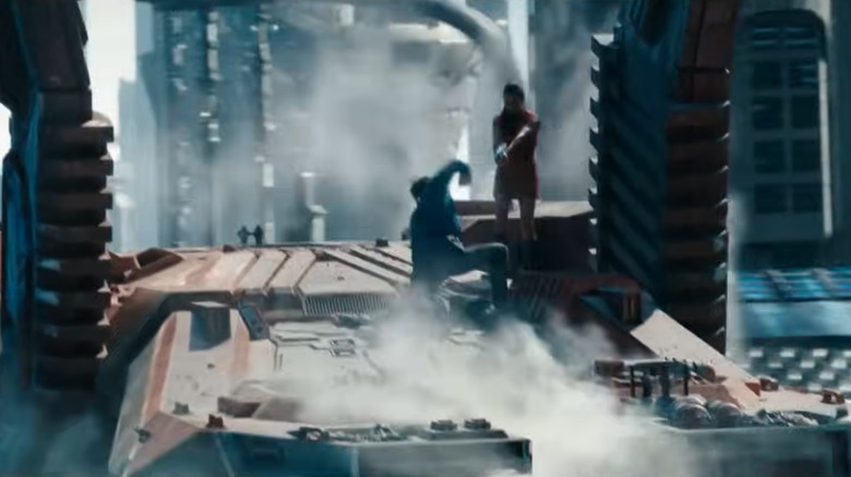Spock attacks Khan in "Star Trek Into Darkness" as Uhura holds a gun