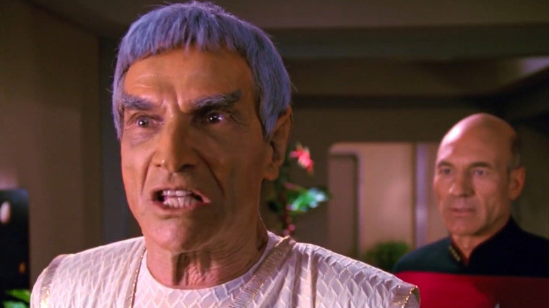 Sarek emotionally breaks down with Picard standing behind