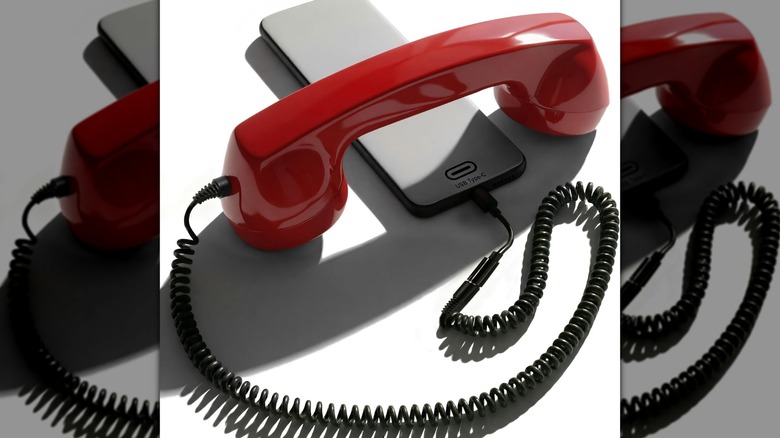An Opis Technology Retro Phone Handset attached to a smartphone.