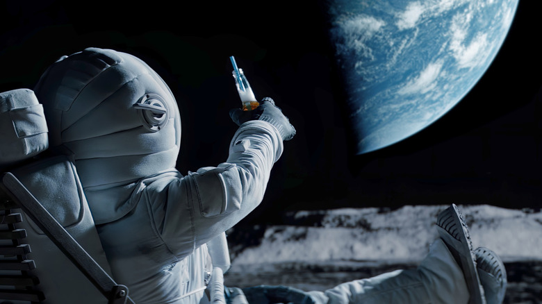 Astronaut having a beer on the moon