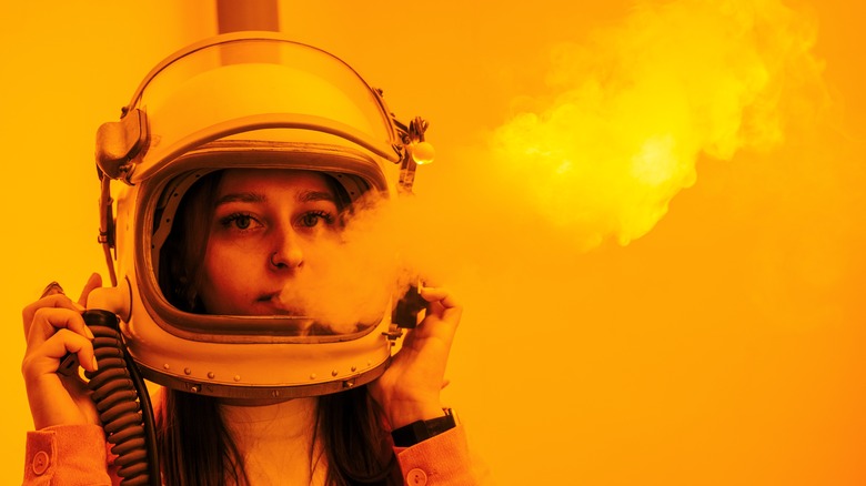 Astronaut with smoke coming from mouth