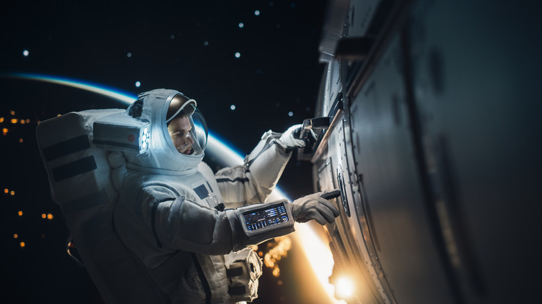 Astronaut performing repairs during spacewalk