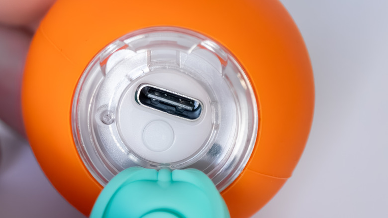 An exposed USB port on a rubber toy.