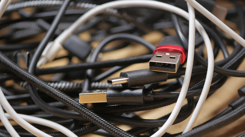 Messy, tangled USB cables.