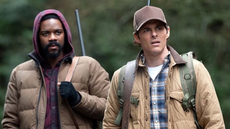 Jovan Adepo and James Marsden wearing backpacks in The Stand