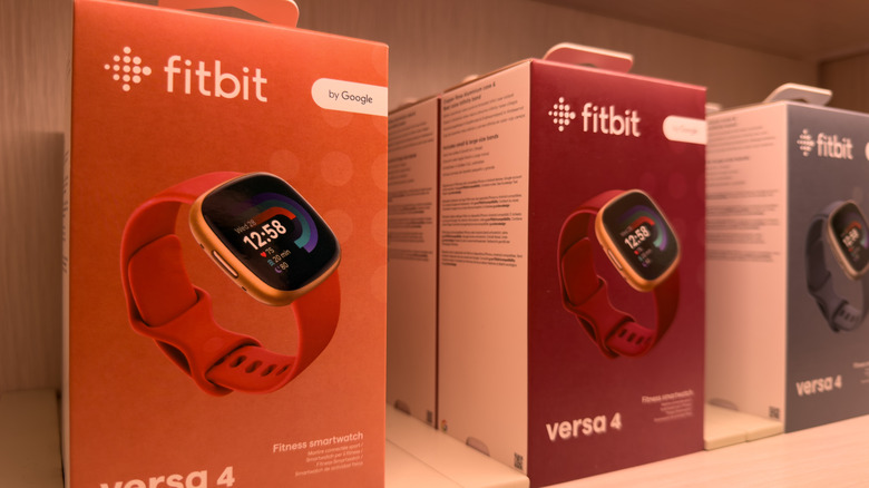 Android smartwatches in their boxes in a retail store