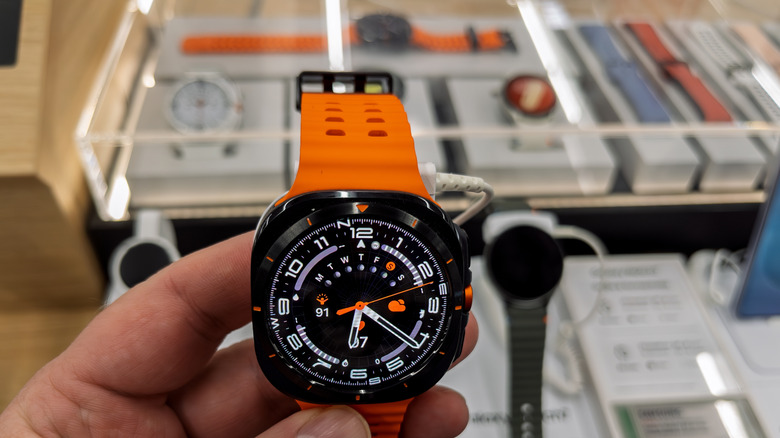 Multiple types of smartwatches in display cases of a retail store