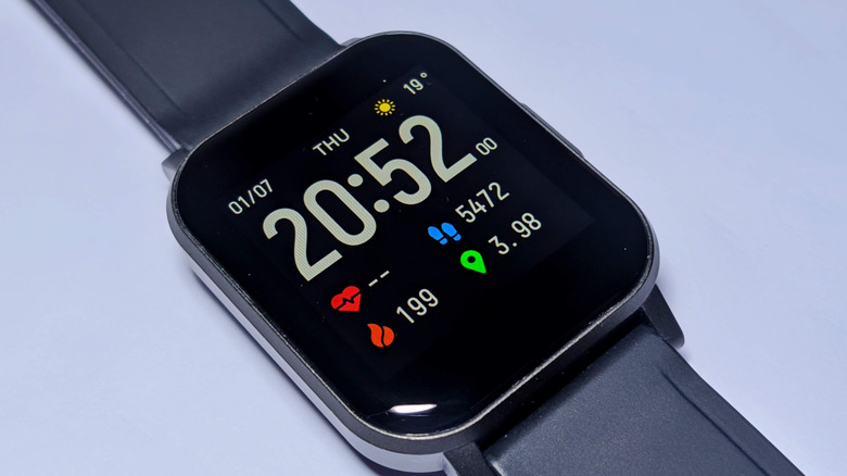A smartwatch display showing multiple statistics on the screen