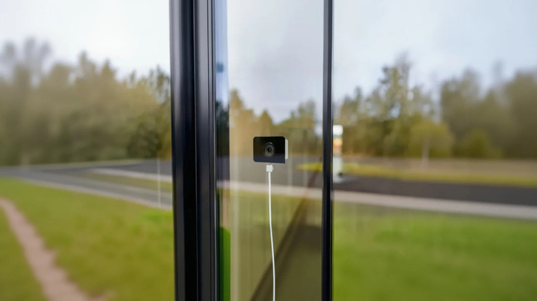 Wyze Window Cam installed on glass window facing the outdoors