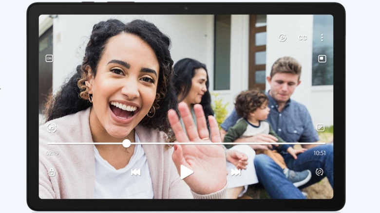 Samsung Galaxy Tab A9+ showing a video call or family video on its screen.