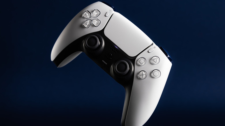 dualsense controller for playstation 5 on a dark blue and vignetted background