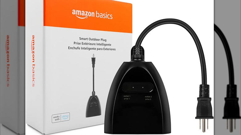 The Amazon Basics Smart Outdoor Plug next to its box.