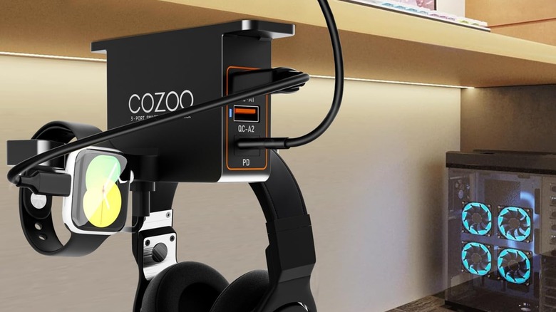 The Cozoo Under Desk Headset Holder attached to the bottom of a desk