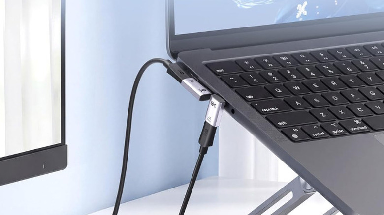 A Cable Matters Right Angle USB-C Adapter Kit plugged into a laptop computer