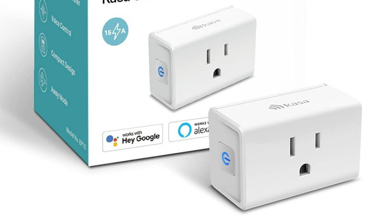 A Kasa Smart Plug Ultra Mini 15A in front of its box against a white background