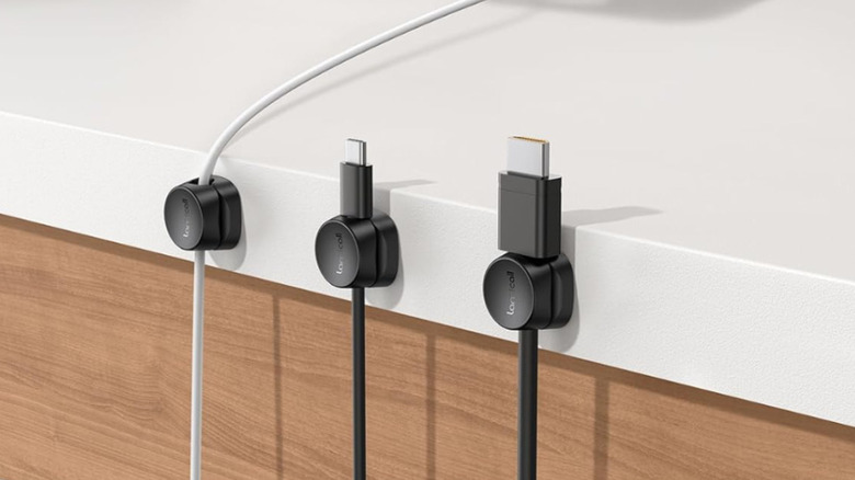 Three Lamicall Cord Organizers on a white and woodgrain vertical surface