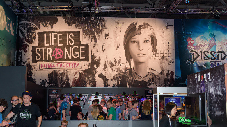 An ad for Life is Strange: Before the Storm at a gaming convention.