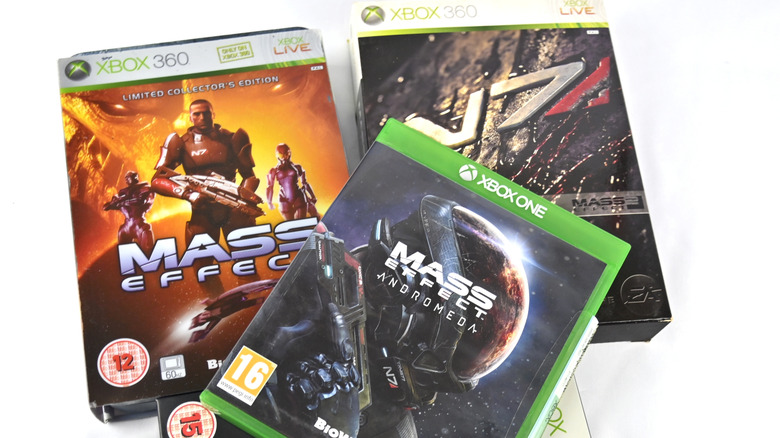 A stack of various Mass Effect game cases.
