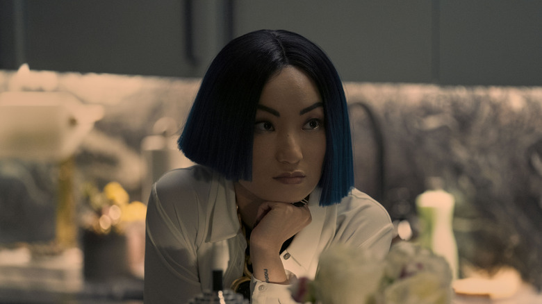 Greta staring thoughtfully across the room in Dead Ringers (2023)