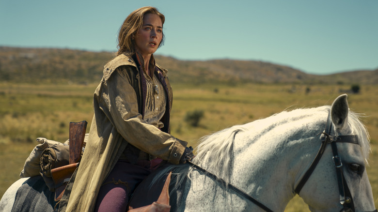 Lady Cornelia Locke riding a white horse across an open landscape in The English (2022)