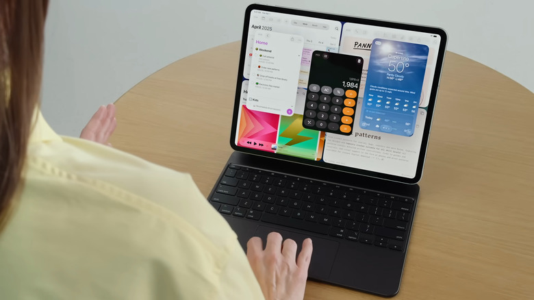 Woman using iPad connected to keyboard