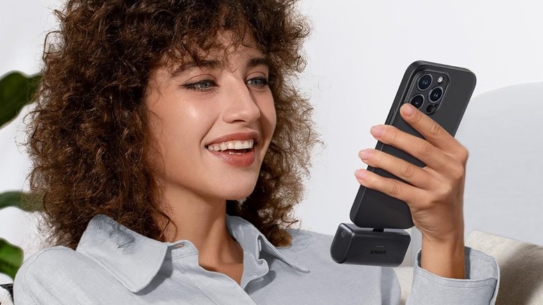 Anker Nano portable USB-C charger plugged into a phone.