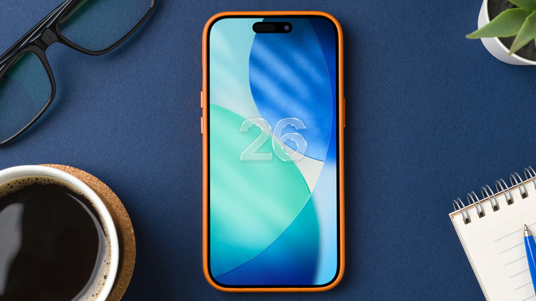The iOS 26 logo on an iPhone 16 Pro