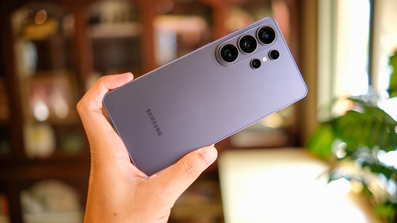 Someone holding a Samsung Galaxy S26, with the back facing the camera