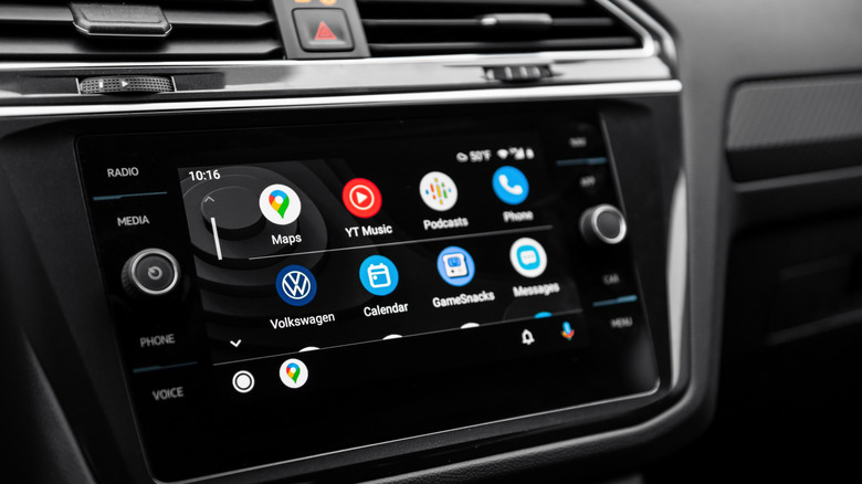 Two rows of app icons as they appear witin Android Auto, apps include Google Maps, YouTube Music, GameSnacks, and more