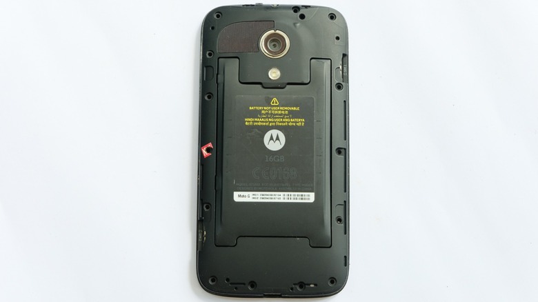 An Motorola Android smartphone with the back removed, leaving the battery exposed for the camera