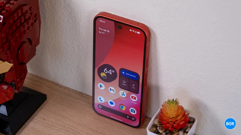 The Pixel 10a mid-range phone resting against a wall.