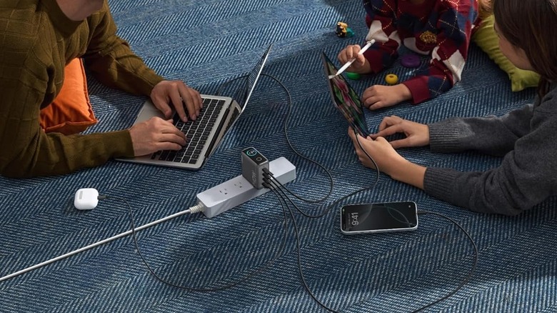 Anker Charger plugged to power strip while charging four devices
